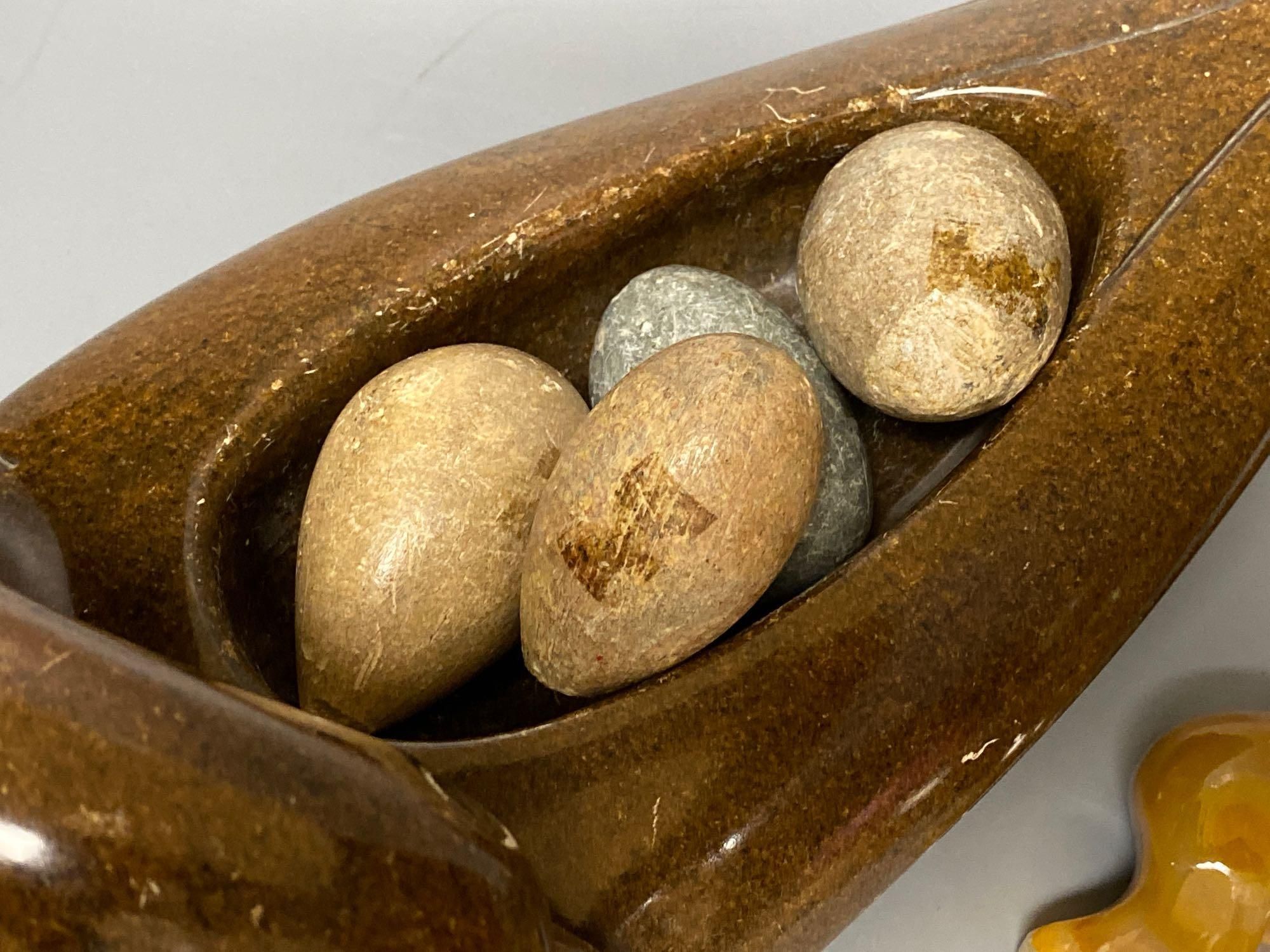 A Shona soapstone dish/duck containing eggs, a turquoise parrot on stand and various hardstone carvings and boxes